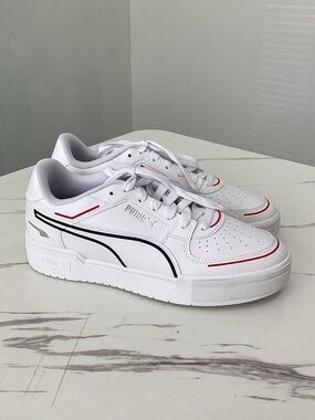 Puma White Trainer with Black Logo and Subtle Navy Detail